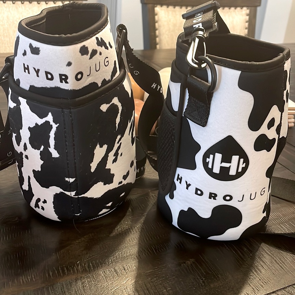 HydroJug original and new cow print sleeves with straps. EUC!